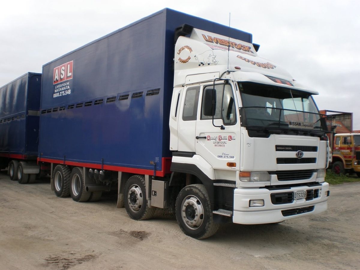 Older ASL Livestock Matamata truck with blue crates and a white UD cab